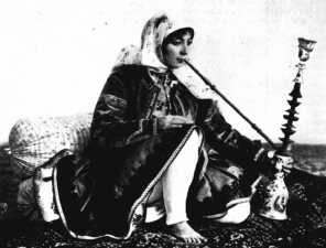 a Persian opium smoker and her pipe